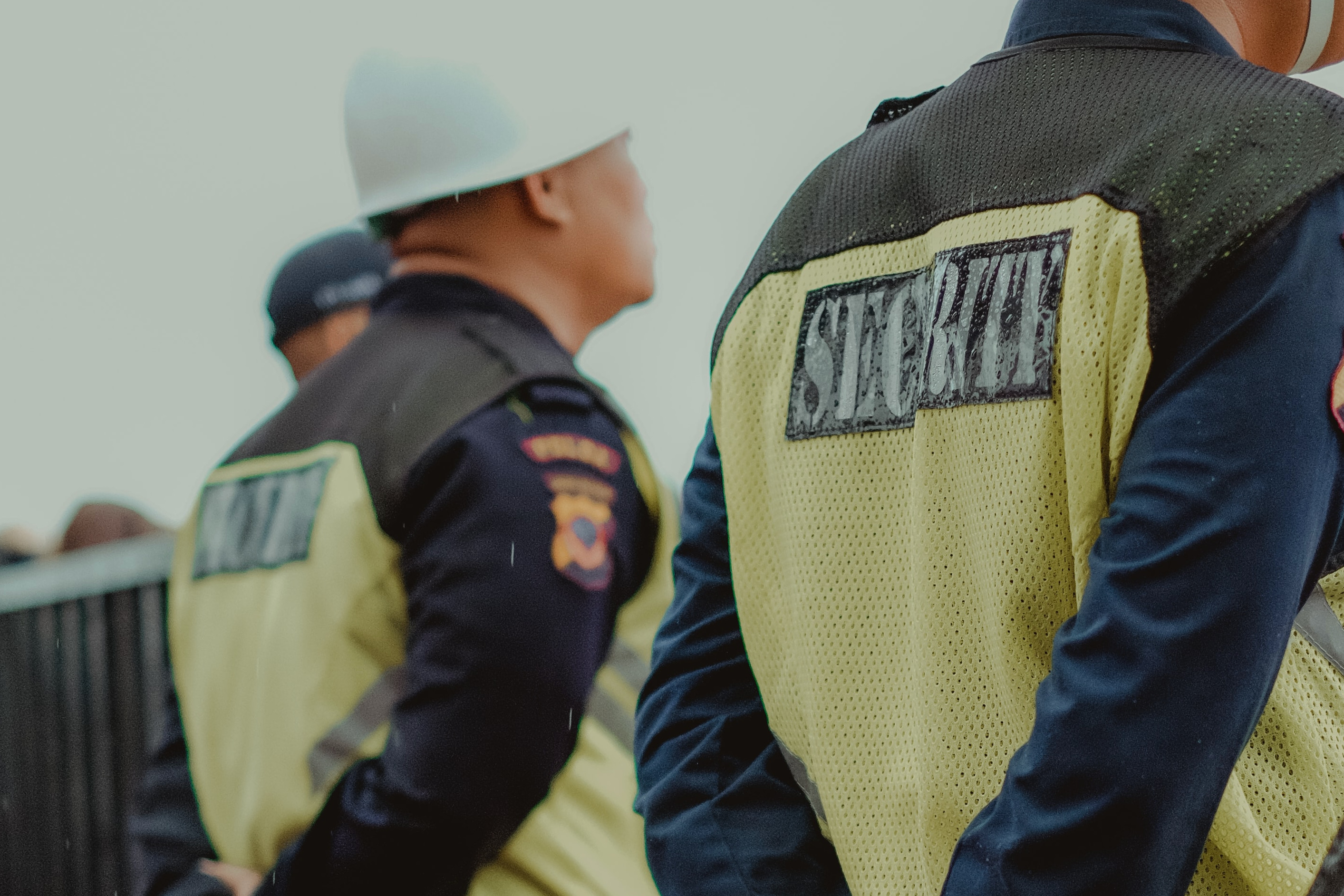 Backs of two security officers