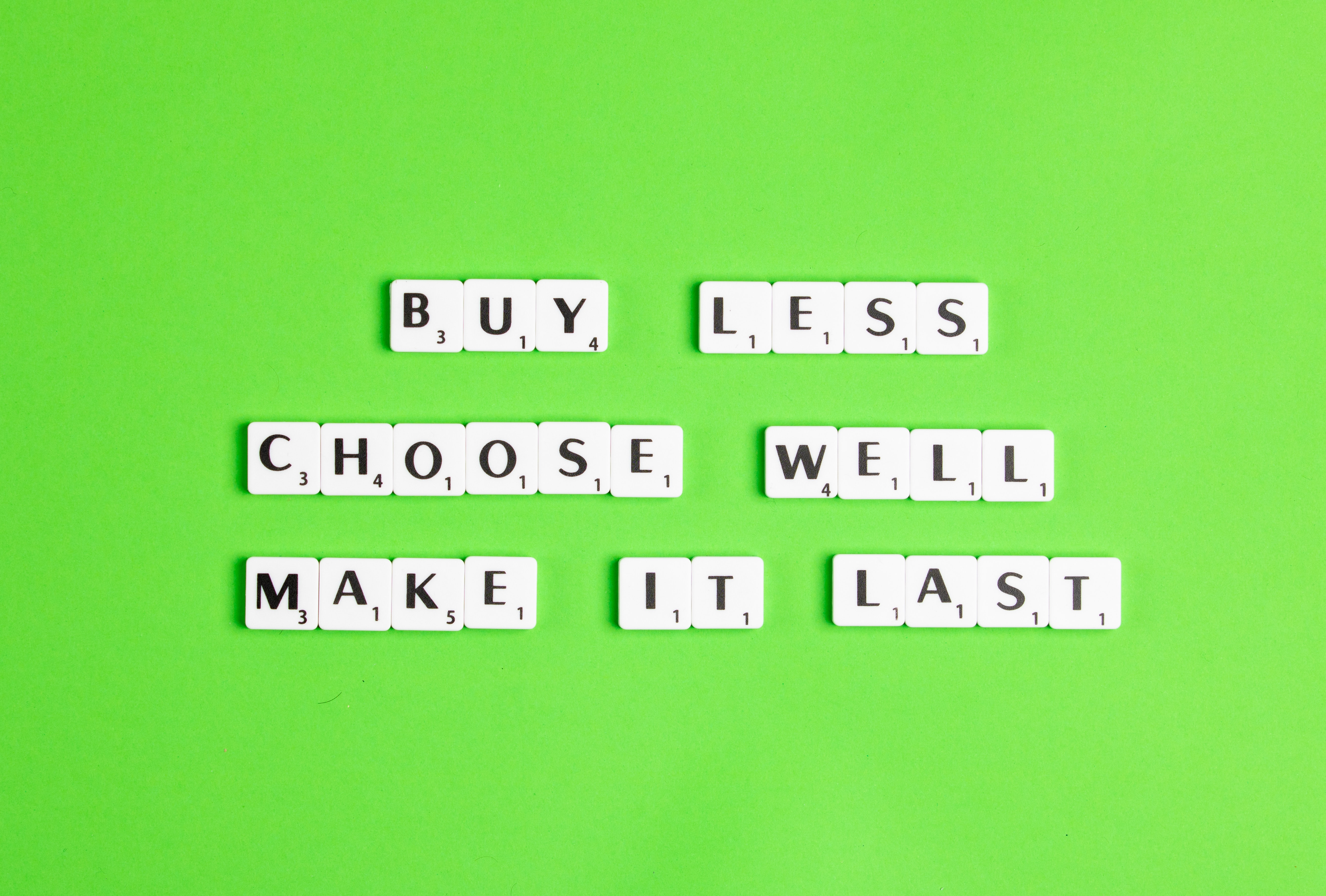 Sentence “Buy Less. Choose well. Make it last.” with letters of the Scrabble game