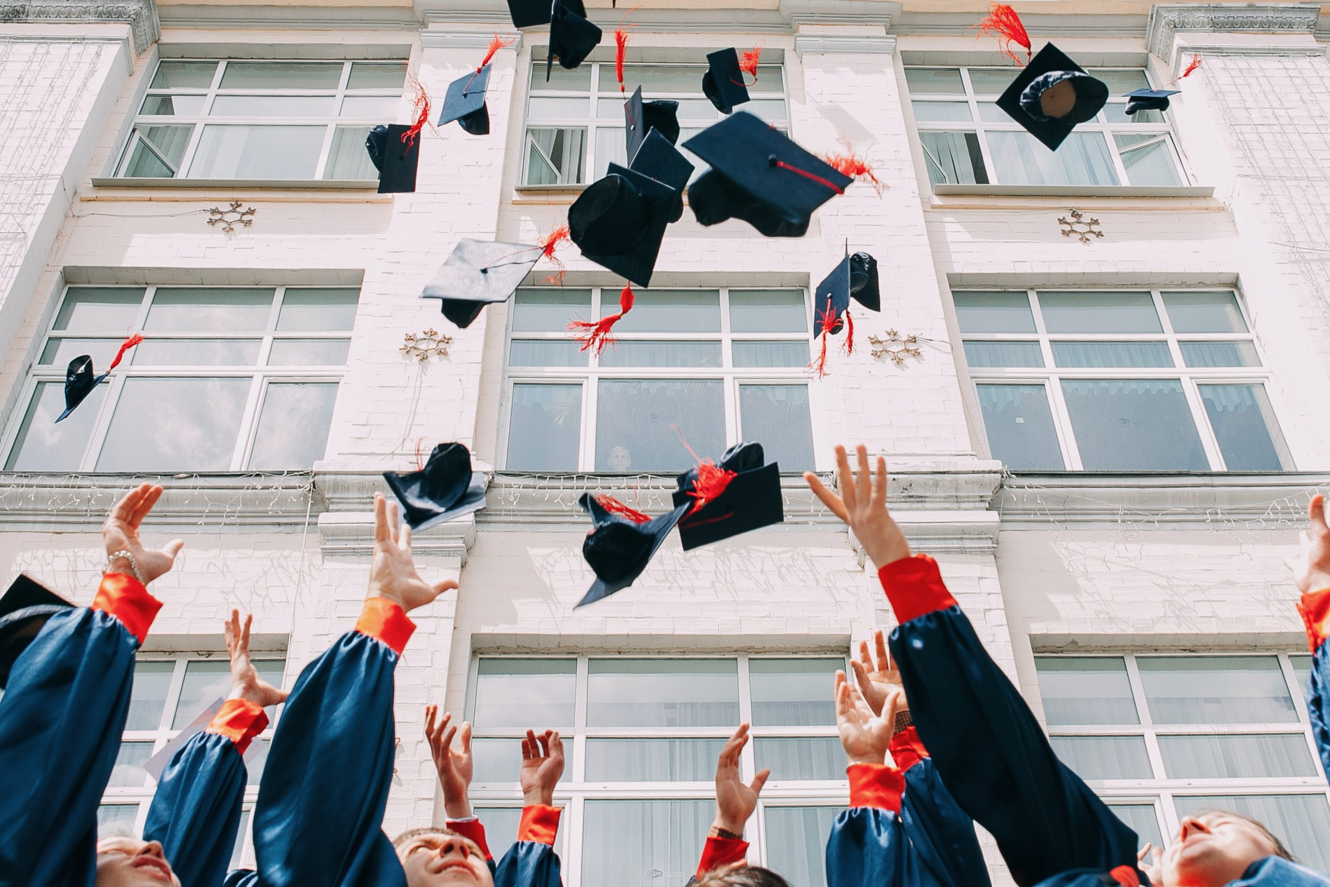 Graduates throwing their hats in the air